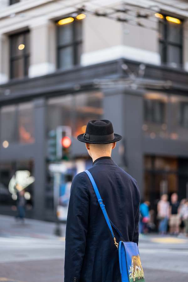 Back of a man walking through the city