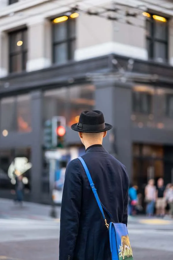 Does Rehab Hurt Job Prospects Back of a man walking through the city