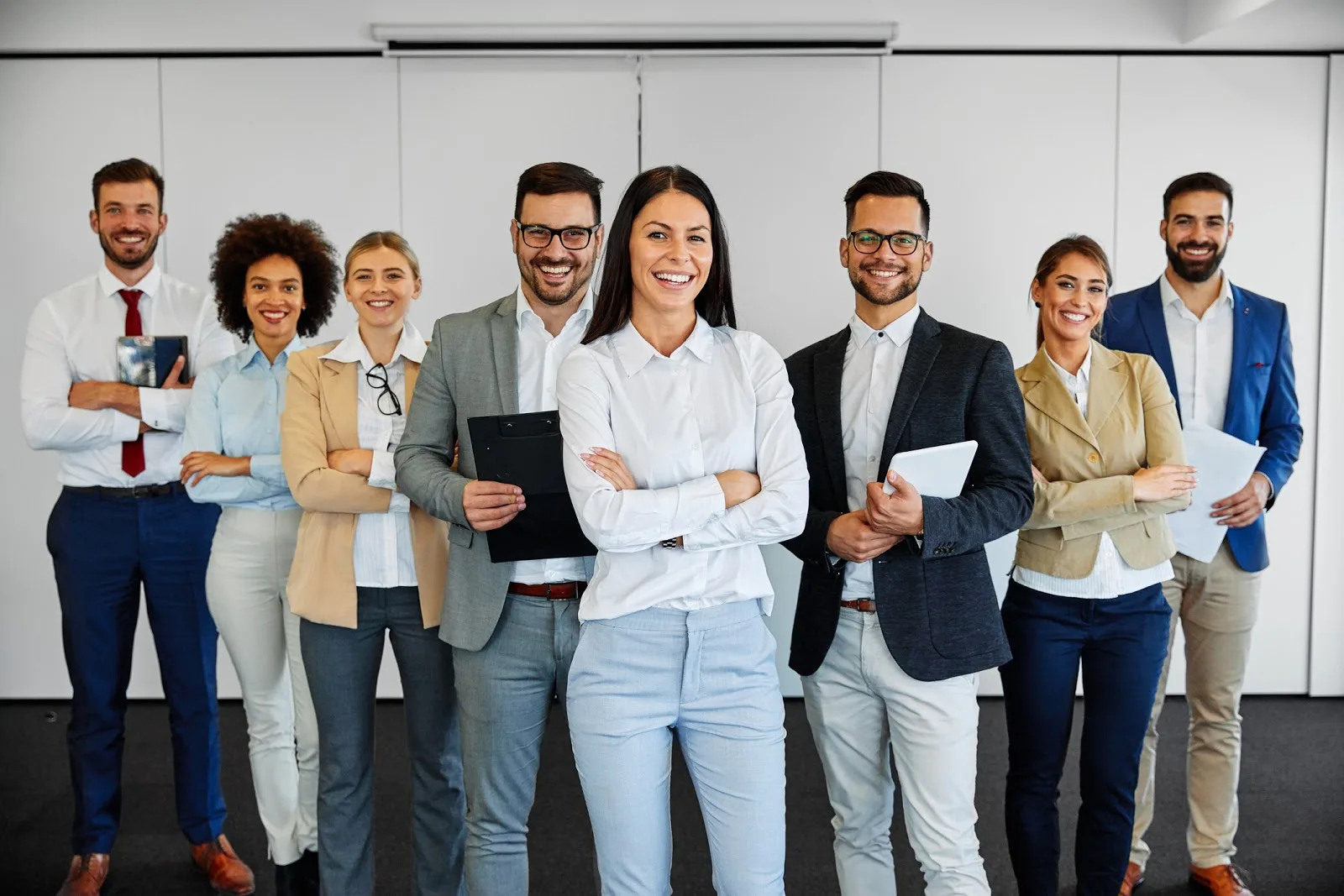 Portrait of successful young business people team in the office The 8 Things You’re not Doing to Improve Employee Productivity