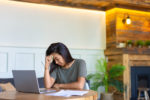 photo-of-an-exhausted-asian-woman-working-at-home-before-the-deadline-conceot-of-modern-technologies-and-gadget-addiction-in-everyday-life-stockpack-gettyimages